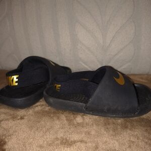 Nike Kids Black Sandals with Gold Accents